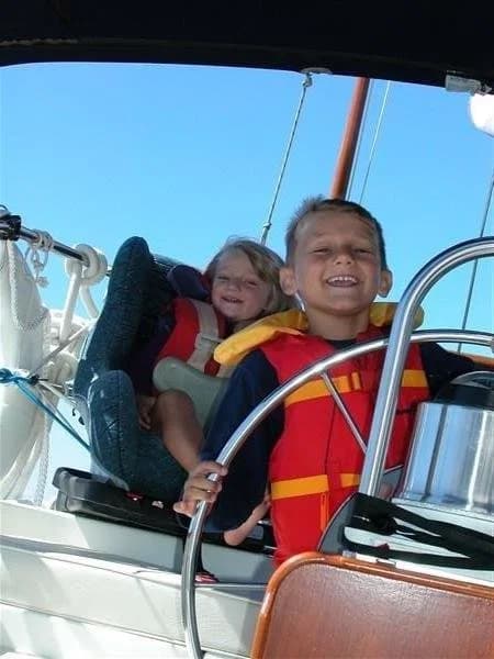 James and his sister at the helm on Lake Ontario