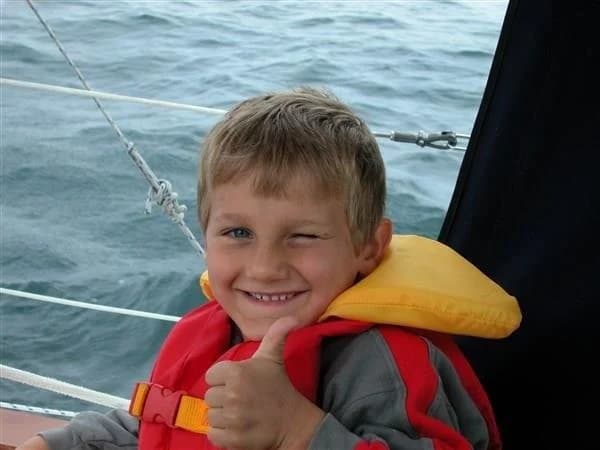 Young James on Lake Ontario, thumbs up